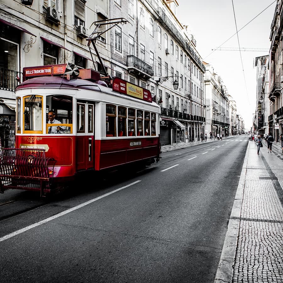 A red tram on a Lisbon street